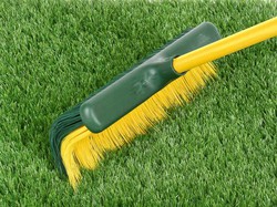 Brush for sweeping artificial grass
