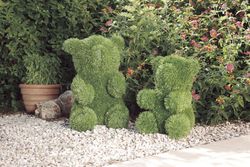 Figura decorativa Orso seduto in erba artificiale